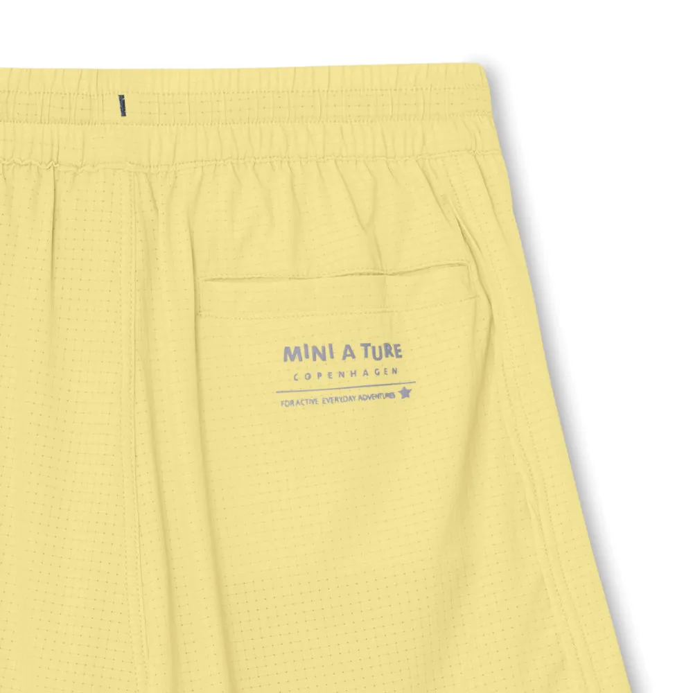 MINI A TURE Matsilas shorts Muted lime med leggings
