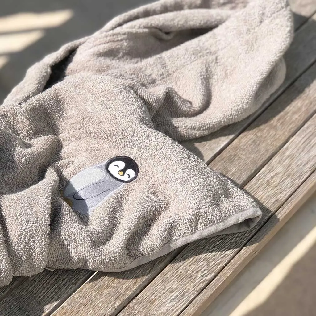 nuuroo Celsa poncho Penguin bomuld 50x50